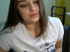 Cute brunette pulls up her shirt to show her boobs on live