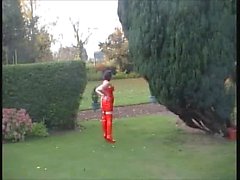 Sexy legs outdoors in full RED PVC top mini and thigh boots