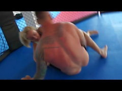 blonde has cock shoved in her mouth in wrestling match