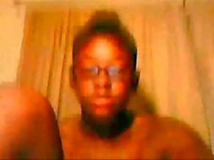 Young ebony teen in glasses poses and fingers her twat and ass on the webcam